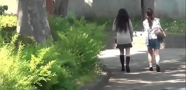  Embarrassed asian pissing outdoors